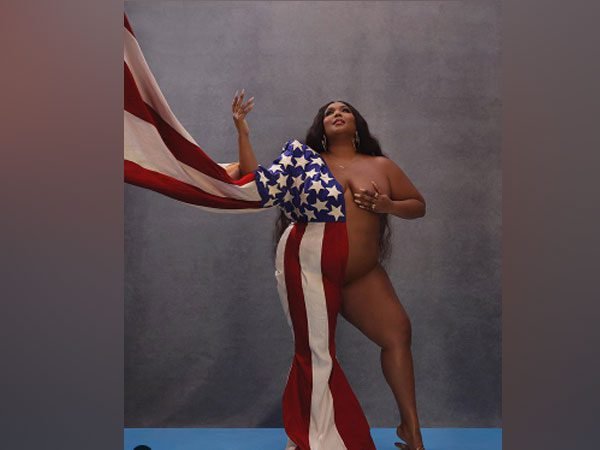 Singer lizzo poses naked with american flag